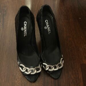 CHANEL Black Peep-Toe Pumps with Silver Chain Accent